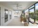Enclosed patio with ceiling fan, outdoor furniture, and adjacent pool at 1940 Dempsey Ln, The Villages, FL 32163