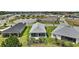 Aerial view of the property with a lake view at 1966 Wallingford Loop, Mount Dora, FL 32757