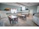 Large bright kitchenette featuring ample cabinet space, seating, and large windows for natural light at 1966 Wallingford Loop, Mount Dora, FL 32757