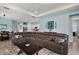 Comfortable living area featuring a large sectional sofa, wood floors, and an open floor plan at 1966 Wallingford Loop, Mount Dora, FL 32757