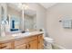 Neutral bathroom with ample counter space, shower, and natural light at 2042 Hydrangea Ave, The Villages, FL 32162