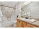 Neutral bathroom features walk-in shower and ample counter space at 2042 Hydrangea Ave, The Villages, FL 32162