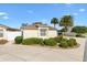 Exterior image of home with manicured landscaping and a well-maintained lawn at 2042 Hydrangea Ave, The Villages, FL 32162