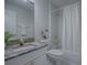 Bright bathroom with a white cabinet, granite countertop, and shower with white tile at 2103 Patino Ln, The Villages, FL 32159