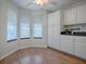 Bright dining area with a ceiling fan and lots of light coming from large bay windows at 2103 Patino Ln, The Villages, FL 32159
