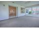 Spacious sunroom featuring sliding glass door entry and abundant natural light at 2103 Patino Ln, The Villages, FL 32159