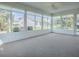 Sunroom featuring many windows that provide ample natural light and great views at 2103 Patino Ln, The Villages, FL 32159