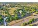 Expansive aerial view of a charming rural property surrounded by lush greenery and a well-maintained landscape at 23519 State Road 44, Eustis, FL 32736