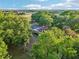 Scenic aerial view of a home surrounded by lush greenery, creating a private and serene setting at 23519 State Road 44, Eustis, FL 32736