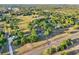 Expansive aerial view of a home nestled in a serene landscape of trees, farms, and rural properties at 23519 State Road 44, Eustis, FL 32736