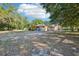 Expansive backyard with a covered patio, offering a perfect space for outdoor activities and relaxation at 23519 State Road 44, Eustis, FL 32736