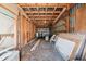 Spacious barn interior filled with lumber, materials, and tools, offering ample storage or workshop space at 23519 State Road 44, Eustis, FL 32736