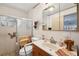 Functional bathroom features a shower with accessibility seating and neutral decor at 23519 State Road 44, Eustis, FL 32736