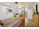 Spacious bedroom features an open layout, wooden floors, and a four-poster bed at 23519 State Road 44, Eustis, FL 32736