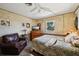 Inviting bedroom features a leather recliner and warm lighting at 23519 State Road 44, Eustis, FL 32736