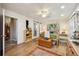 Bright bedroom features a four-poster bed, wood floors, and natural light at 23519 State Road 44, Eustis, FL 32736