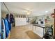 This large garage area boasts painted floors and walls, storage solutions and a sliding glass door at 23519 State Road 44, Eustis, FL 32736
