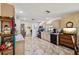The kitchen showcases neutral-toned cabinetry, tile flooring and stainless steel appliances, offering functionality and style at 23519 State Road 44, Eustis, FL 32736