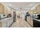 The kitchen features expansive countertops, stainless steel appliances, and flows seamlessly into the adjacent dining area at 23519 State Road 44, Eustis, FL 32736