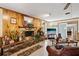 Comfortable living room with wood accents and a large brick fireplace at 23519 State Road 44, Eustis, FL 32736