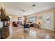 Inviting living room with tile floors, a ceiling fan, and an abundance of natural light at 23519 State Road 44, Eustis, FL 32736