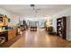 Spacious open-concept living room with hardwood floors and multiple windows providing an abundance of natural light at 23519 State Road 44, Eustis, FL 32736