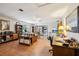 Comfortable living room featuring hardwood floors, neutral walls, and abundant space for various activities and decor at 23519 State Road 44, Eustis, FL 32736
