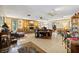 Expansive living room features wood accents, tile flooring, and comfortable seating at 23519 State Road 44, Eustis, FL 32736