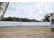 Backyard featuring a volleyball net, surrounded by a white privacy fence, perfect for recreation and outdoor gatherings at 2600 Pisces Dr, Orlando, FL 32837