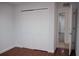 Bright room with wood-look floors, a spacious closet, and access to the en-suite bathroom at 2600 Pisces Dr, Orlando, FL 32837