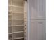 Walk-in closet with ample storage space with adjustable shelving and multiple drawers at 2600 Pisces Dr, Orlando, FL 32837