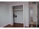 Spacious closet with double folding doors and a shelf, situated in a bright room at 2600 Pisces Dr, Orlando, FL 32837