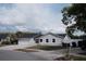 Charming single-story home with a well-maintained lawn, attached garage, and mailbox at 2600 Pisces Dr, Orlando, FL 32837
