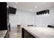 Open concept kitchen featuring granite countertops, dark wood cabinets, and a modern light fixture at 2600 Pisces Dr, Orlando, FL 32837