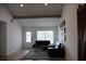 Bright living room with vaulted ceilings, exposed beams, tile floors, and modern decor at 2600 Pisces Dr, Orlando, FL 32837