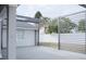 A backyard patio features a pergola-style roof and modern privacy screens for comfortable outdoor space at 2600 Pisces Dr, Orlando, FL 32837