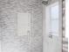Modern shower with gray mosaic tile, glass door and shower niche at 2600 Pisces Dr, Orlando, FL 32837