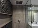 Modern glass shower with mosaic tile and gray accent at 2600 Pisces Dr, Orlando, FL 32837
