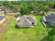 A stunning aerial view of the home showcasing its spacious lot and verdant surroundings in a serene neighborhood at 26301 Sackamaxon Dr, Sorrento, FL 32776