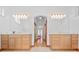 Bright bathroom features dual sinks, mirrors, and a hallway view at 26301 Sackamaxon Dr, Sorrento, FL 32776