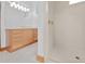 Bathroom featuring a seamless glass shower and a vanity with ample storage at 26301 Sackamaxon Dr, Sorrento, FL 32776