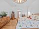 Bright bedroom featuring wood floors, a ceiling fan, and bright, neutral paint at 26301 Sackamaxon Dr, Sorrento, FL 32776