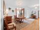 Elegant dining room featuring hardwood floors, chandelier lighting, and a decorative rug at 26301 Sackamaxon Dr, Sorrento, FL 32776