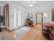 Spacious foyer with hardwood floors, and decorative front door at 26301 Sackamaxon Dr, Sorrento, FL 32776