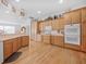 Open kitchen with a breakfast bar, modern appliances, ample counter space, and hardwood floors at 26301 Sackamaxon Dr, Sorrento, FL 32776