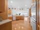 Bright open concept kitchen with a breakfast bar with hardwood floors and stainless appliances at 26301 Sackamaxon Dr, Sorrento, FL 32776