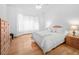 Bright main bedroom with hardwood floors and large windows at 26301 Sackamaxon Dr, Sorrento, FL 32776