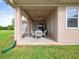 Outdoor patio with ceiling fan and access to spacious backyard at 26301 Sackamaxon Dr, Sorrento, FL 32776