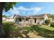Backyard features a screened-in porch and a solar panel roof at 26535 Deuce Ct, Leesburg, FL 34748