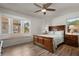 Bedroom with hard surface flooring and large windows for ample natural light at 26535 Deuce Ct, Leesburg, FL 34748